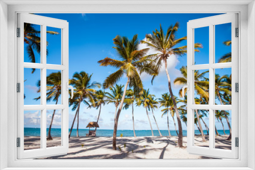 Fototapeta Naklejka Na Ścianę Okno 3D - 
Sea Caribbean landscape in Dominican republic with palm trees, sandy beach, green mountains, rocks, blue sky and turquoise water 