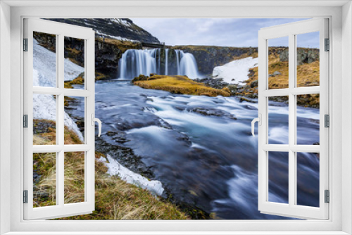 Fototapeta Naklejka Na Ścianę Okno 3D - Kirkjufellsfoss, waterfalls at Kirkjufell, surrounded by melting snow in Spring