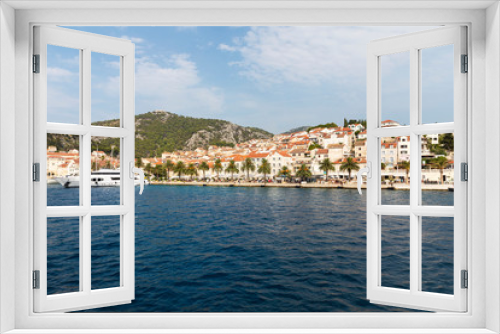 Fototapeta Naklejka Na Ścianę Okno 3D - Hvar town on Hvar island, view from the sea on a sunny day in the summer blue sky. Clear adriactic water, the south mediterranean coast of Croatia in Europe. Beautiful landscape with mountains