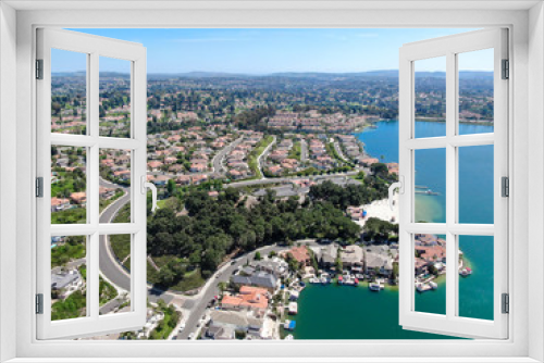 Fototapeta Naklejka Na Ścianę Okno 3D - Aerial view of Lake Mission Viejo, with recreational facilities, surrounded by private residential and condominium communities. Orange County, California, USA
