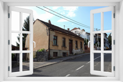 Fototapeta Naklejka Na Ścianę Okno 3D - Family houses in Zagreb, damaged after strong earthquake that hit the city. House in picture suffered damage on the facade, roof and both of the chimneys were completely or partly broken off