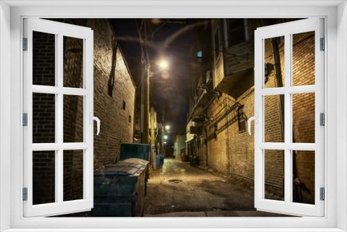 Fototapeta Naklejka Na Ścianę Okno 3D - Dark and eerie urban city alley at night