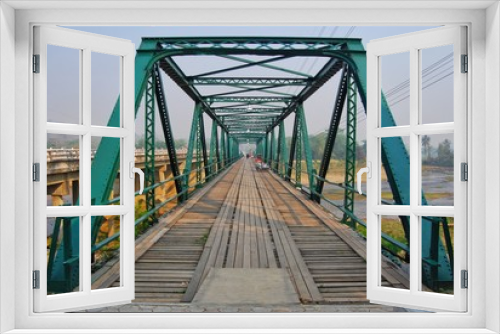 Fototapeta Naklejka Na Ścianę Okno 3D - Pai Historical Bridge, an iron bridge for people walking and river views. Is the main tourist attraction of the Pai district.
