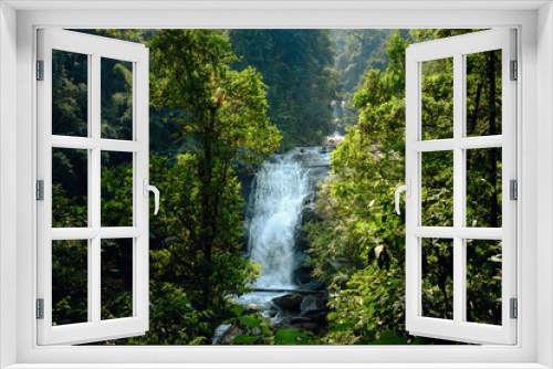 Fototapeta Naklejka Na Ścianę Okno 3D - stunning view of the waterfall through green forest