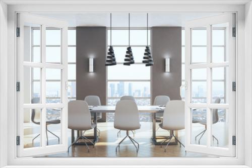 Modern meeting room with panoramic city view.