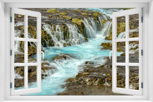 Fototapeta Naklejka Na Ścianę Okno 3D - The beautiful and spectacular bruarfoss waterfall in Iceland, the blue water stream in summer This is a hidden waterfall in a popular photographer secret place.