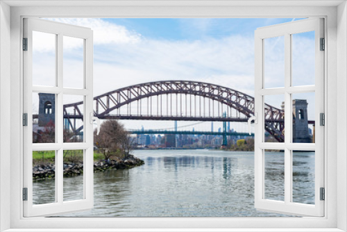 Fototapeta Naklejka Na Ścianę Okno 3D - The Hell Gate Bridge over the East River during Spring in Astoria Queens New York