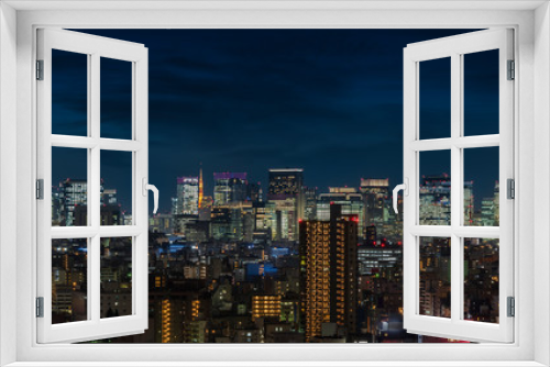 Fototapeta Naklejka Na Ścianę Okno 3D - Aerial night panoramic view of the skyscrapers of Tokyo illuminated.