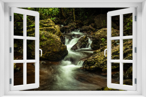 Fototapeta Naklejka Na Ścianę Okno 3D - waterfall cover with green lush forest long exposure flat angle image