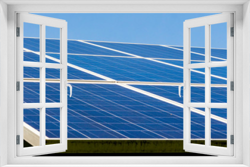 Fototapeta Naklejka Na Ścianę Okno 3D - Solar Panels Supplying Clean, Renewable Energy to a High School