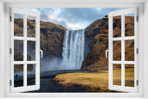 Fototapeta Naklejka Na Ścianę Okno 3D - Stunning view of the famous Skogafoss waterfall, Iceland. Hydro energy. Power of water.