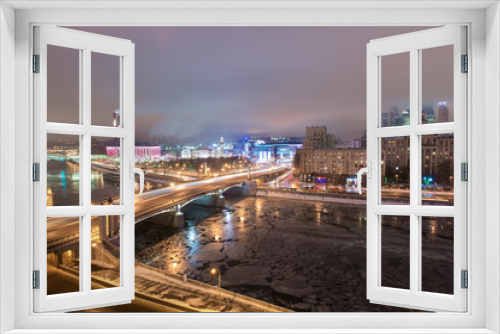 Fototapeta Naklejka Na Ścianę Okno 3D - MOSCOW, RUSSIA - 4 JANUARY 2017: Night view to Borodinsky Bridge over the Moskva river, Evropeisky shopping mall and Moscow City international business center on background