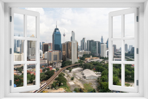 Fototapeta Naklejka Na Ścianę Okno 3D - Panoramic view of Kuala Lumpur skyline at day time. City center of capital of Malaysia. Contemporary buildings exterior with glass.