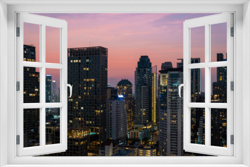 Fototapeta Naklejka Na Ścianę Okno 3D - Panoramic view of Bangkok skyline at sunset. Modern city center of capital of Thailand. Contemporary buildings exterior with glass.