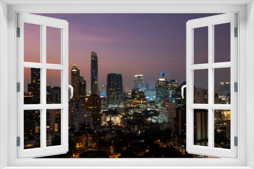 Fototapeta Naklejka Na Ścianę Okno 3D - Panoramic view of Bangkok skyline at sunset. Modern city center of capital of Thailand. Contemporary buildings exterior with glass.