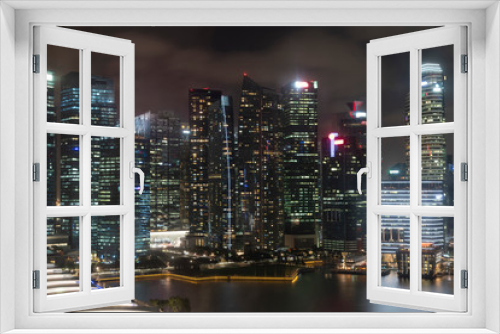 Fototapeta Naklejka Na Ścianę Okno 3D - Picturesque panoramic view of Singapore city at night time. Financial and trading center hub in Asia region. Concept of success. Modern buildings in high-tech world.