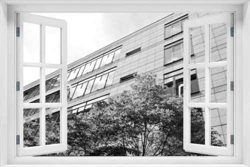 Fototapeta Naklejka Na Ścianę Okno 3D - The windows of a modern building for offices. Business buildings architecture. Black and white.