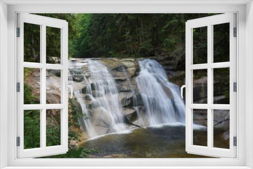 Fototapeta Naklejka Na Ścianę Okno 3D - Flowing stream with a waterfall in nature