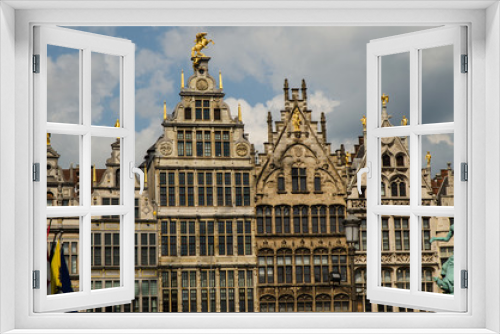 Fototapeta Naklejka Na Ścianę Okno 3D - Antwerp, Flanders, Belgium. August 2019. On a beautiful sunny day detail of the facades of the guild houses in the town hall square. Elegant gilding embellishes the Renaissance architecture.