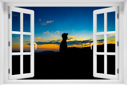 Fototapeta Naklejka Na Ścianę Okno 3D - Silhouette Man Standing on Hill with  Cap at the Sunset on Mountain with Blue Sky. Enjoying Peaceful Moment Concept.