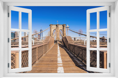 Fototapeta Naklejka Na Ścianę Okno 3D - Brooklyn bridge at day time when Sparse tourists in coronavirus or covid19 outbreak situation, Famous landmarks in New York city, USA or United States of America, Travel and Tourism concept