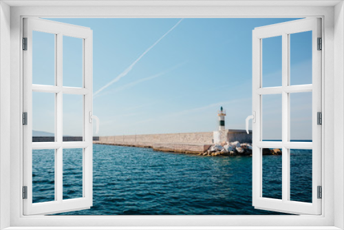 Fototapeta Naklejka Na Ścianę Okno 3D - lighthouse on the island of crete greece, old lighthouse on the pier, ionian sea, greece