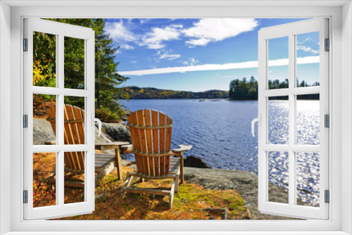 Fototapeta Naklejka Na Ścianę Okno 3D - Adirondack chairs at lake shore