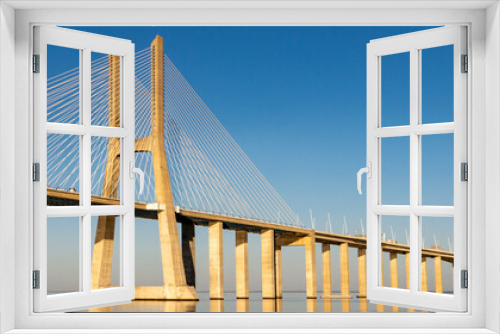 Fototapeta Naklejka Na Ścianę Okno 3D - Suspension Vasco da Gama bridge over the Tagus river in Lisbon, Portugal