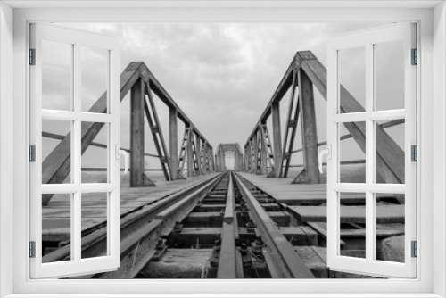 Fototapeta Naklejka Na Ścianę Okno 3D - Iron railway bridge crosses the river