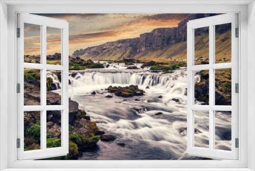 Fototapeta Naklejka Na Ścianę Okno 3D - Typical Icelandic nature landscape. powerful glacier river with waterfall and old Volcanic mount with colorful sky during sunset. Fantastic Iceland nature