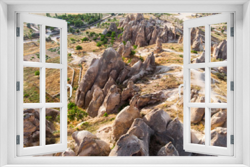 Fototapeta Naklejka Na Ścianę Okno 3D - Aerial view of Goreme National Park, Tarihi Milli Parki, Turkey. The typical rock formations of Cappadocia with fairy chimneys and desert landscape. Travel destinations, holidays and adventure