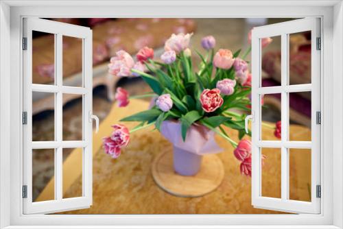 Fototapeta Naklejka Na Ścianę Okno 3D - Bouquet of pink tulips in a vase on a table in the interior in the Renaissance style