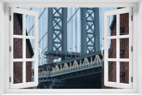Fototapeta Naklejka Na Ścianę Okno 3D - Close-up of the Manhattan Bridge, seen from Dumbo, New York, USA - moody Day