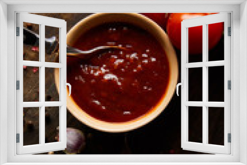 Fototapeta Naklejka Na Ścianę Okno 3D - top view of delicious tomato sauce in bowl with spoon near tomatoes and spices on wooden board