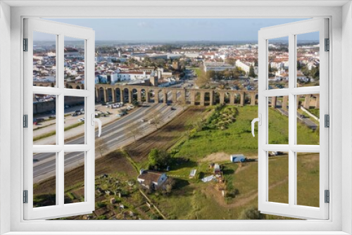 Fototapeta Naklejka Na Ścianę Okno 3D - Aerial view of the Água de Prata aqueduct in Évora, Portugal. Monumental aqueduct in the city of Évora