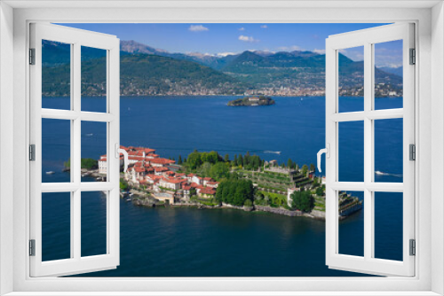 Fototapeta Naklejka Na Ścianę Okno 3D - Isola Bella is located on Lake Maggiore in Italy. Gorgeous garden Borromee in the background the alps in the snow, clouds in the blue sky