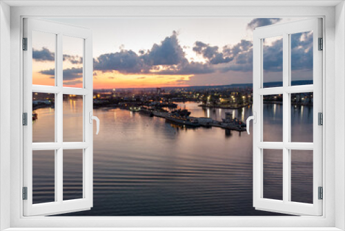 Fototapeta Naklejka Na Ścianę Okno 3D - Drone View of the Sea and the Varna Sea Port at sunset time with dramatic sky