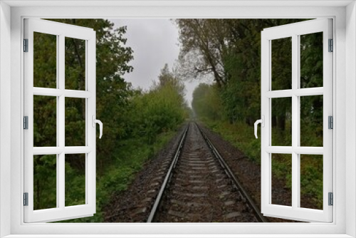 Fototapeta Naklejka Na Ścianę Okno 3D - sleepers rails railroad linear perspectives bottom view stones rubble trees