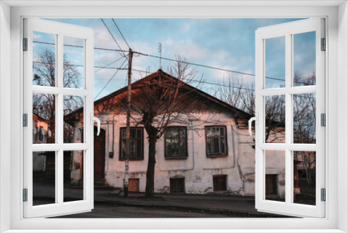 Fototapeta Naklejka Na Ścianę Okno 3D - The pre-war housing estate. Settlement Amber at sunset