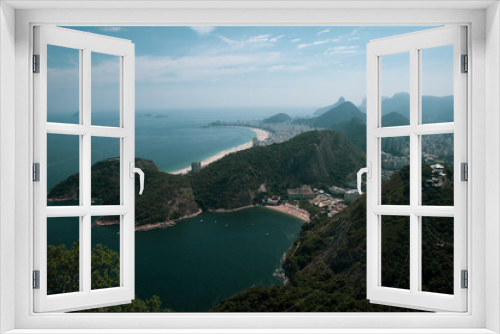 Fototapeta Naklejka Na Ścianę Okno 3D - View of the Sugar Loaf in Botafogo, a mountain, and a landscape of Rio de Janeiro from a cable car, Brazil. 
