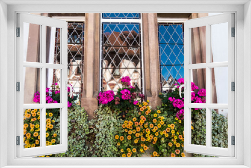 Fototapeta Naklejka Na Ścianę Okno 3D - Flowers on all windows in the villages of Colmar, Alsace, France