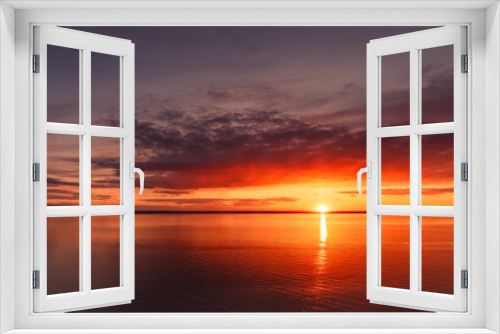 Fototapeta Naklejka Na Ścianę Okno 3D - Beautiful view of the sea and sunset. Beautiful nature landscape with dramatic clouds sunset sky and views of the sea surface. Postcard view. Nature. Concept. Golden sunset