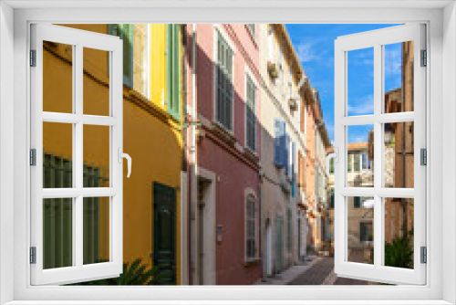 Fototapeta Naklejka Na Ścianę Okno 3D - A pedestrian alleyway with colorful houses in the picturesque resort town of Cassis in  Southern France