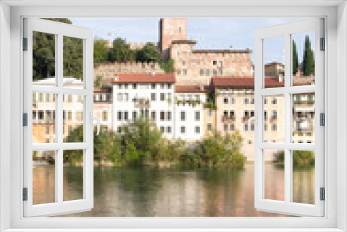 Fototapeta Naklejka Na Ścianę Okno 3D - Bassano del Grappa, Italy, 10/22/2019 , view of the buildings on the east side of brenta river in Bassano del grappa.
