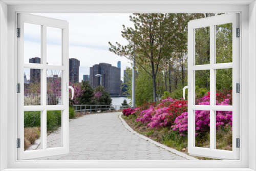 Fototapeta Naklejka Na Ścianę Okno 3D - Empty Riverfront at Hunters Point South Park in Long Island City Queens New York with Colorful Flowers during Spring