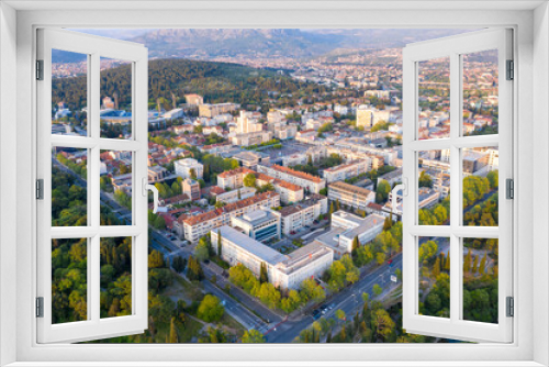 Fototapeta Naklejka Na Ścianę Okno 3D - Podgorica, capital of Montenegro: panoramic aerial view. The city is renowned for its green parks. This small country is located on the Balkans peninsula on the Mediterranean, in South Eastern Europe.