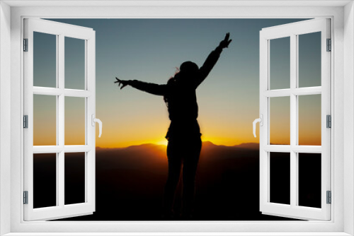 Fototapeta Naklejka Na Ścianę Okno 3D - Woman, power, and victory concept.. Silhouette of Woman open arm under sunset. Silhouette of free woman enjoying freedom feeling happy at sunset. relaxing woman in pure happiness. 