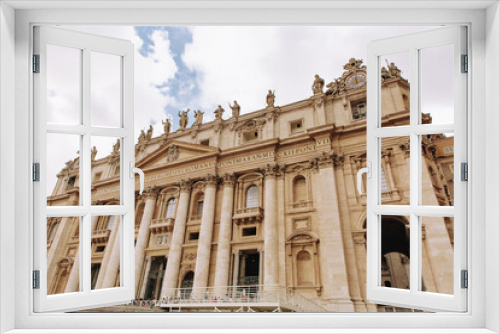 Fototapeta Naklejka Na Ścianę Okno 3D - St. Peter, Vatican City. Low angle view of the statue of St. Peter in St. Peter's Square, Vatican City, with the façade of the Basilica in the background.