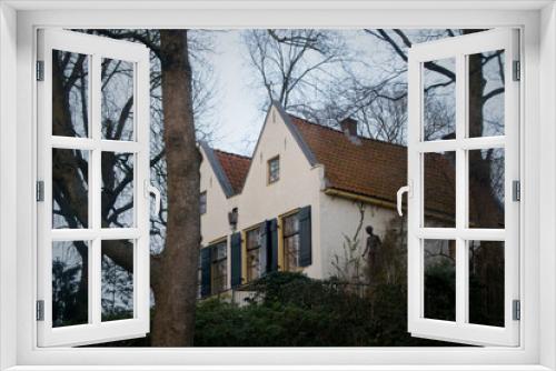 Fototapeta Naklejka Na Ścianę Okno 3D - Beautiful house in a typical Dutch style surrounded by trees. Utrecht, The Netherlands.