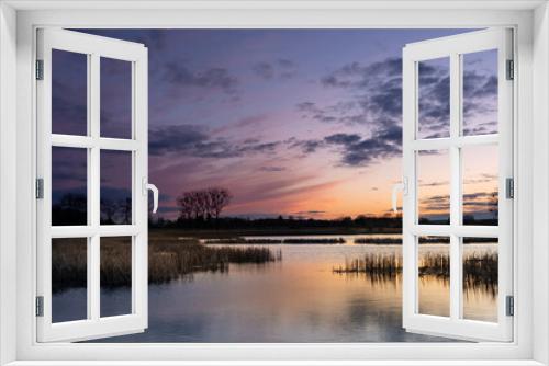 Fototapeta Naklejka Na Ścianę Okno 3D - Beautiful colorful clouds after sunset, reeds in a calm lake